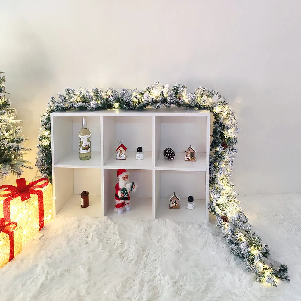 American-style flocked rattan Christmas garland in red, draped over a mantelpiece.