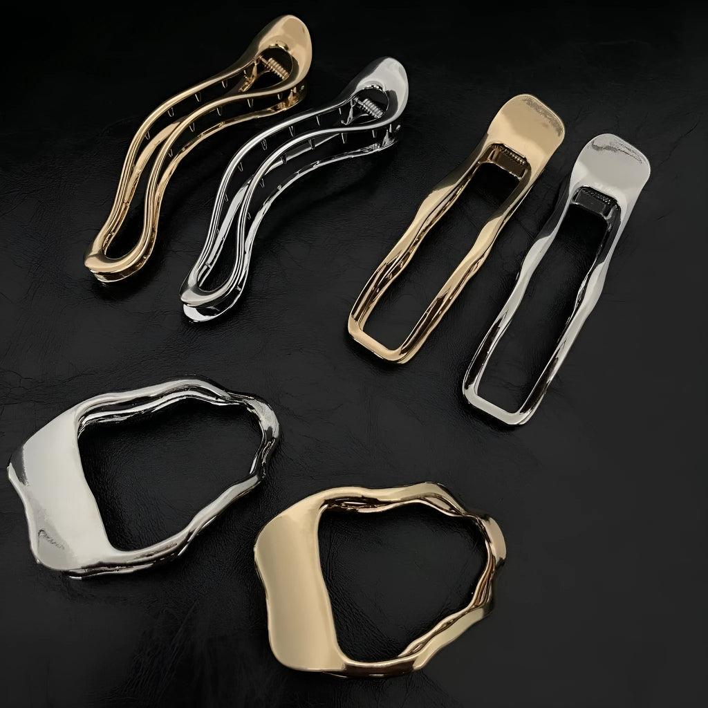 Gold and silver zinc alloy hair barrettes in arc, square, and triangle shapes for women.