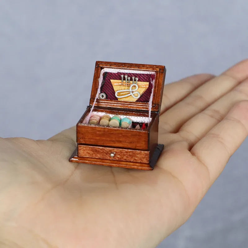 Miniature wooden sewing machine ornament with European-style design on display