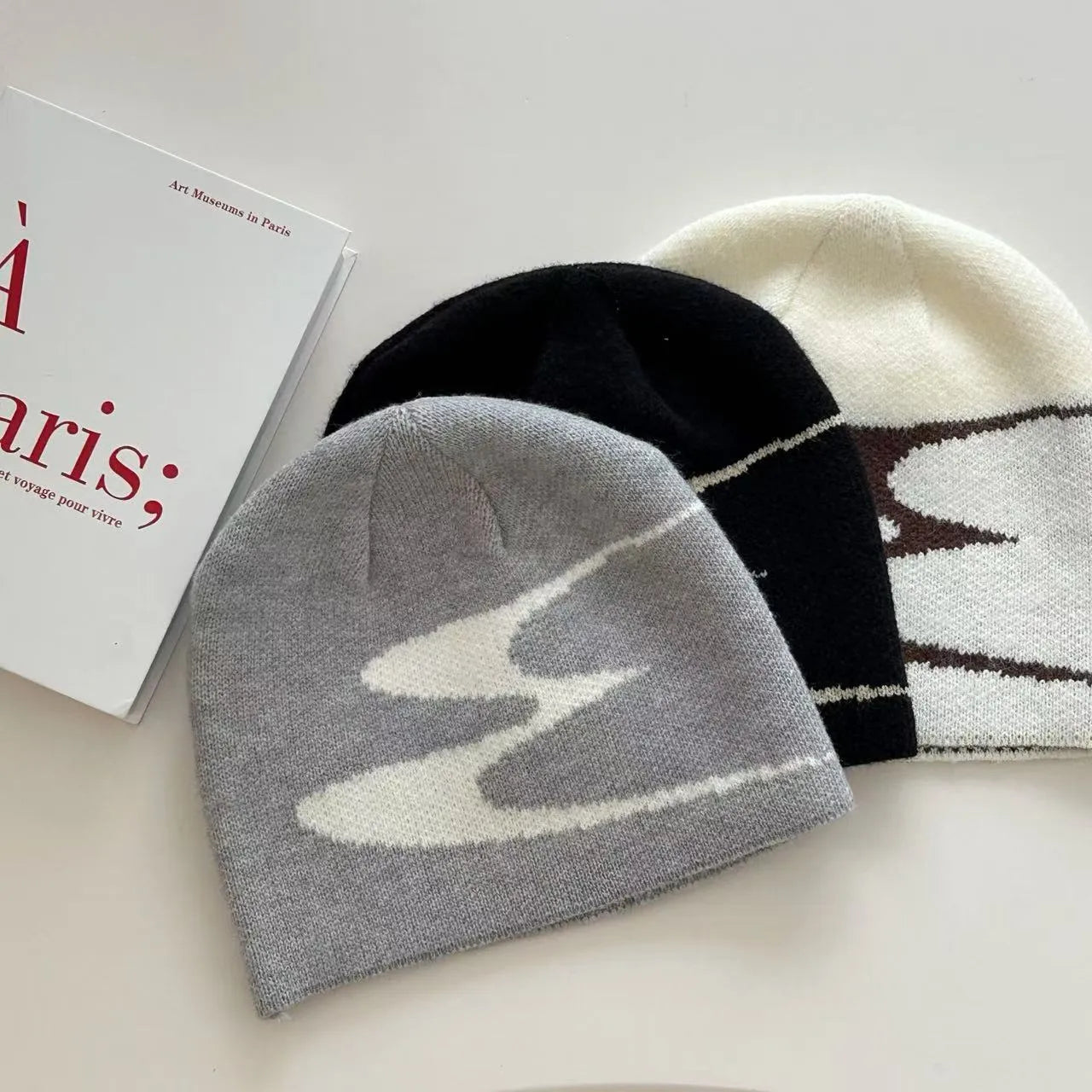 Acrylic thermal knitting beanie cap in black, white, and grey colours for autumn and winter wear