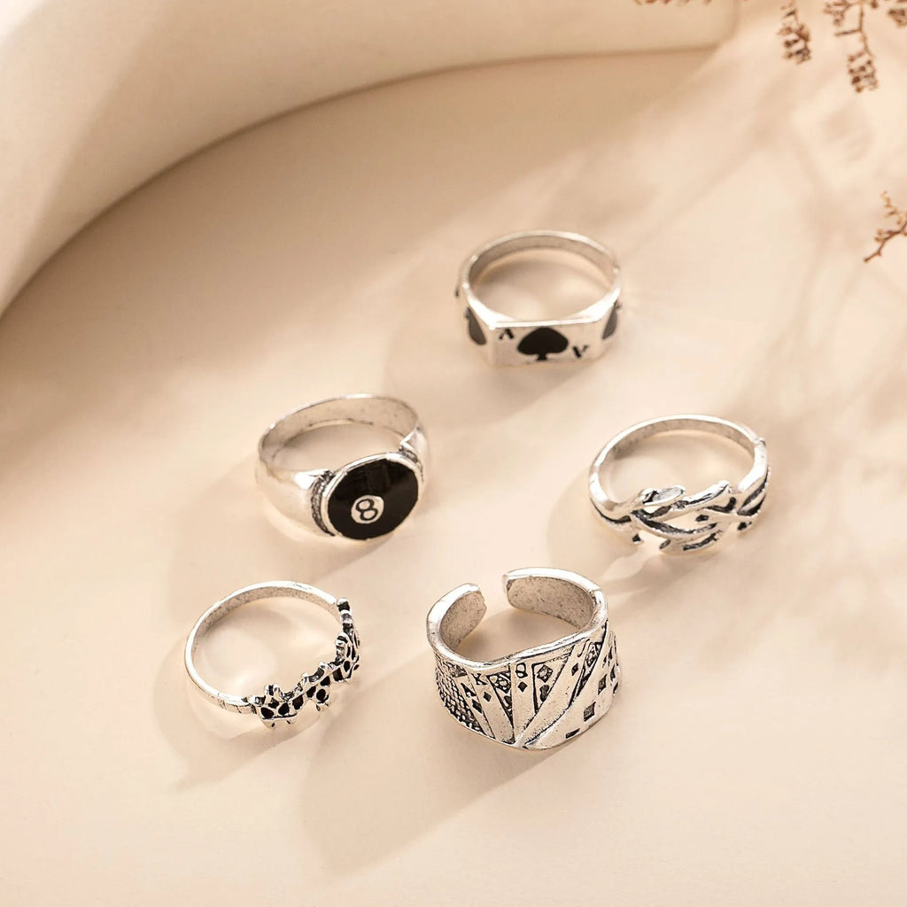 Black alloy women's ring with a detailed retro spade card design on its face.