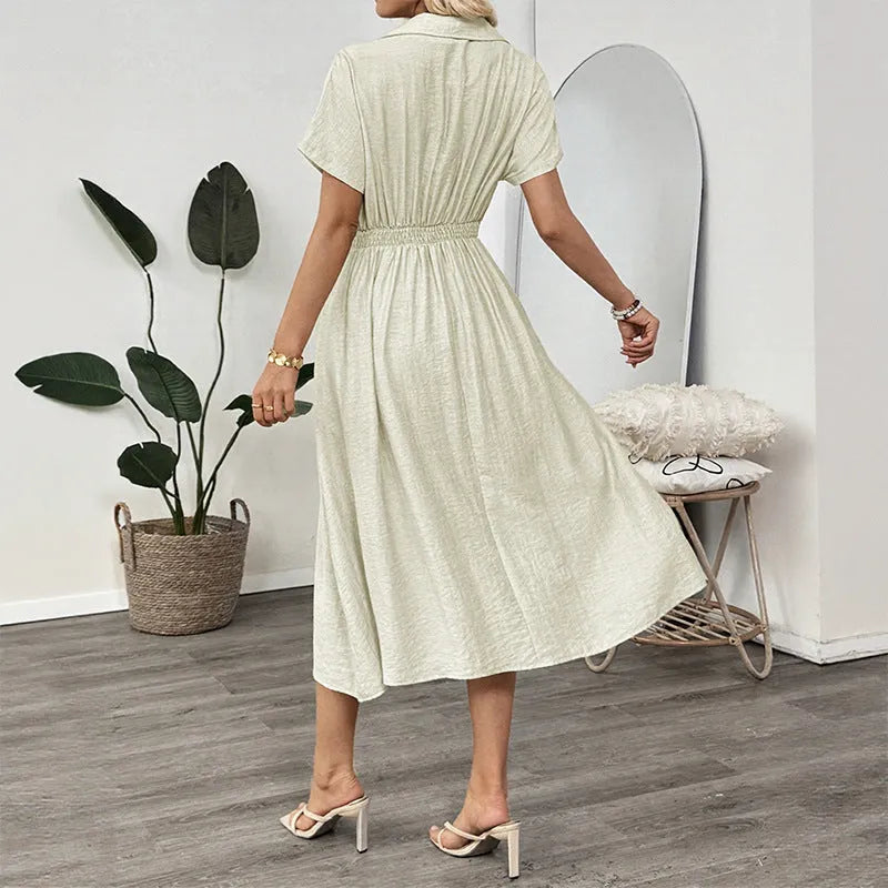 Light green women's shirt dress with lapel collar, waist tie, and hidden skirt pockets on a hanger.