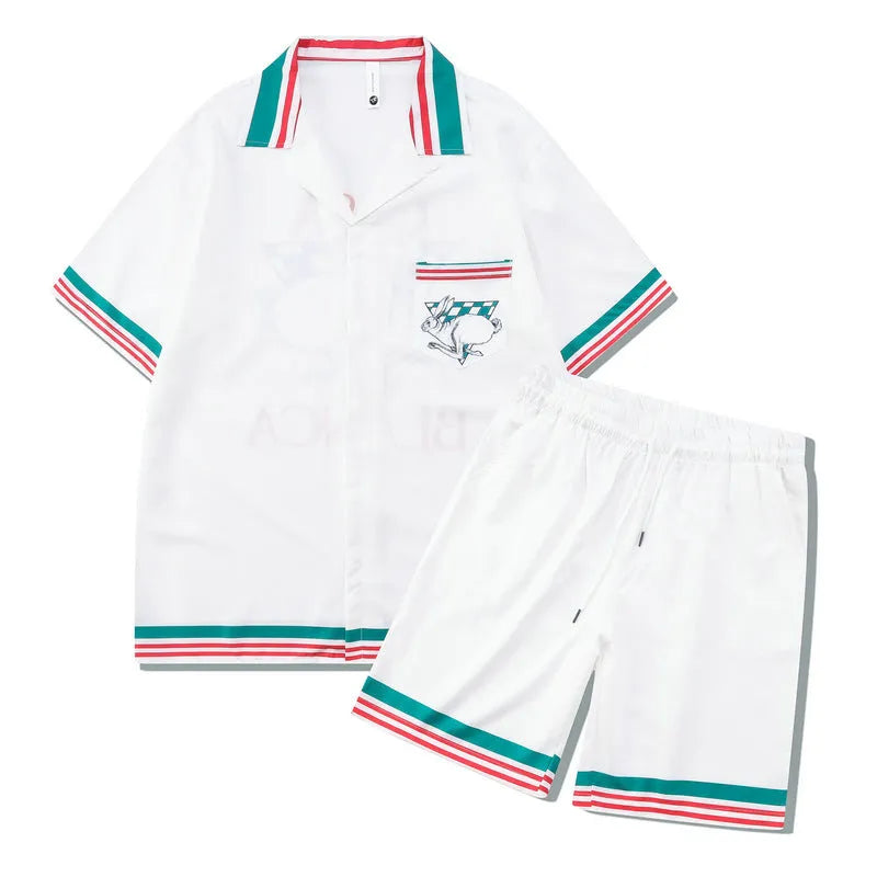 Men's plaid beach outfit with short sleeve shirt and matching trousers on hanger