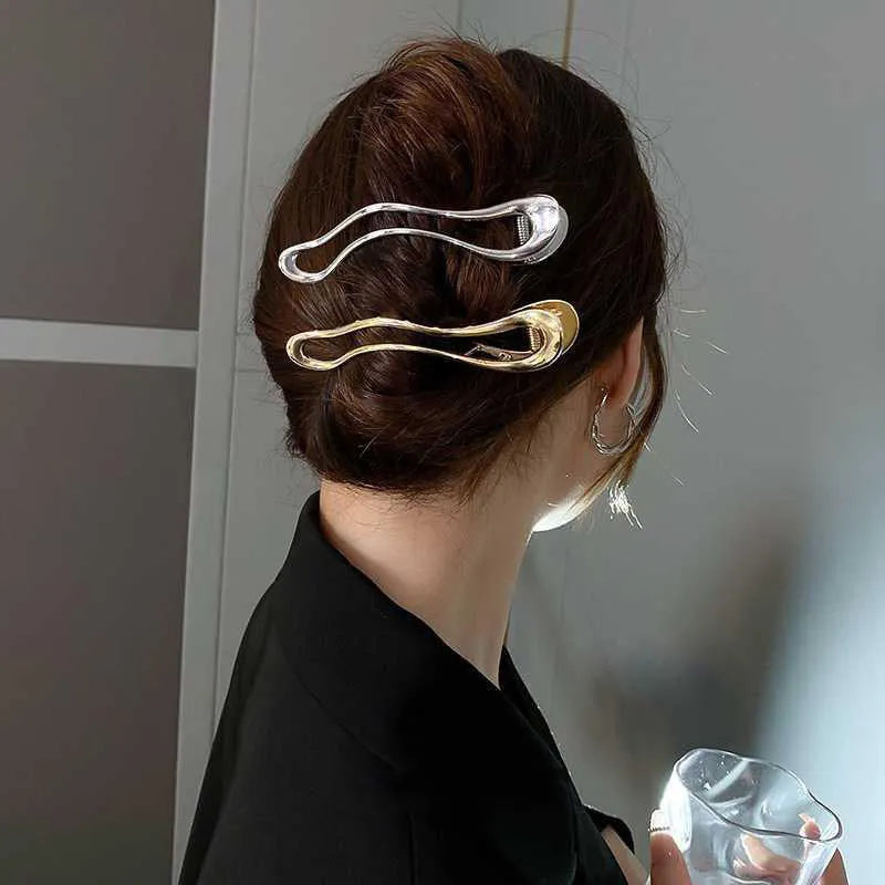 Gold and silver zinc alloy hair barrettes in arc, square, and triangle shapes for women.