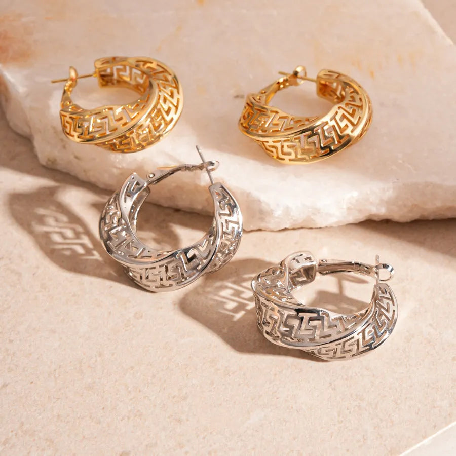 Women's geometric hollow stud earrings with twisted round design in silver or gold electroplated finish