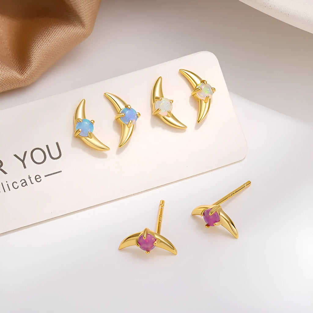 A pair of women's geometric drop earrings made from 925 sterling silver with coloured stones, shown in a gold tone finish.
