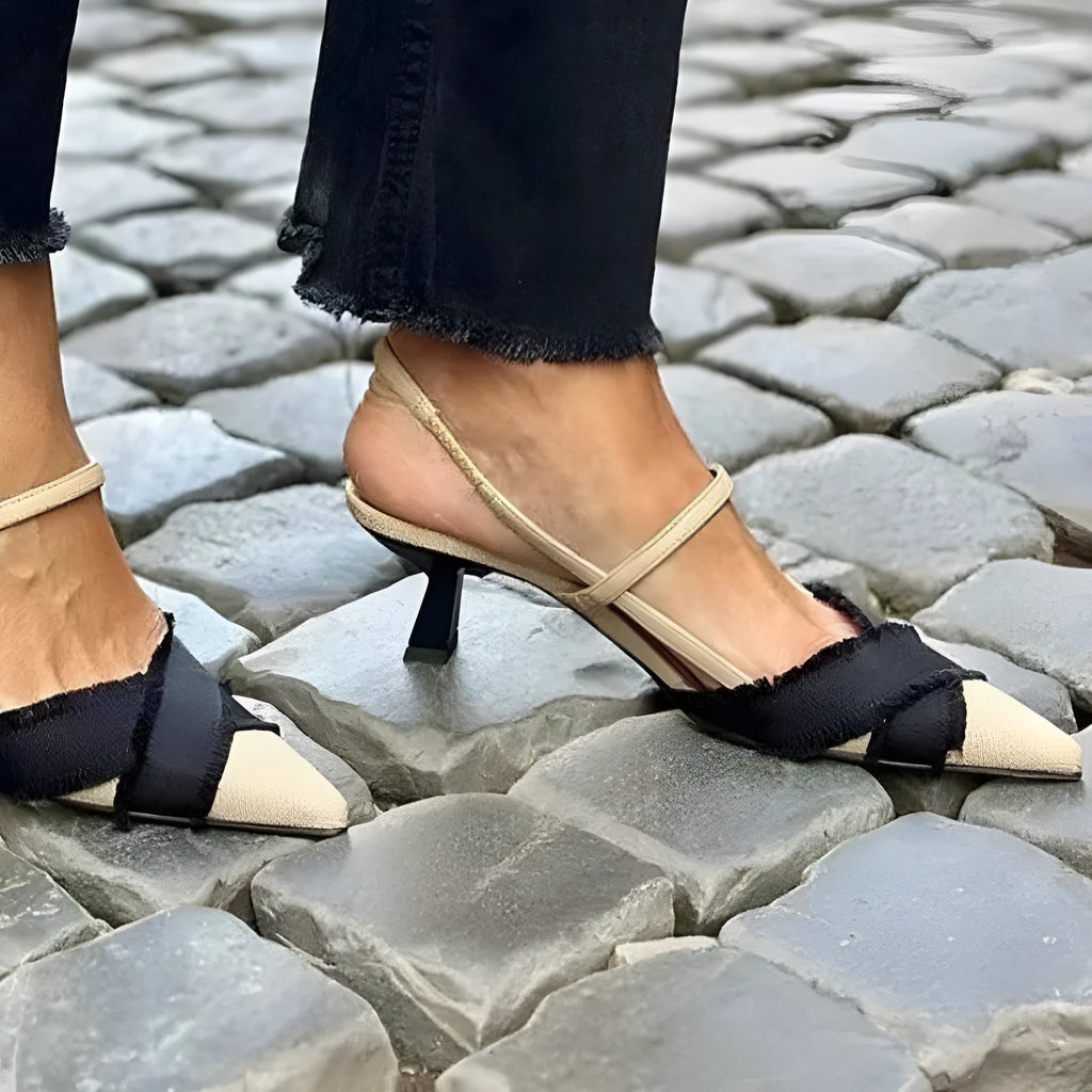 Apricot and black women's stiletto heel sandals with a pointed toe and buckle strap