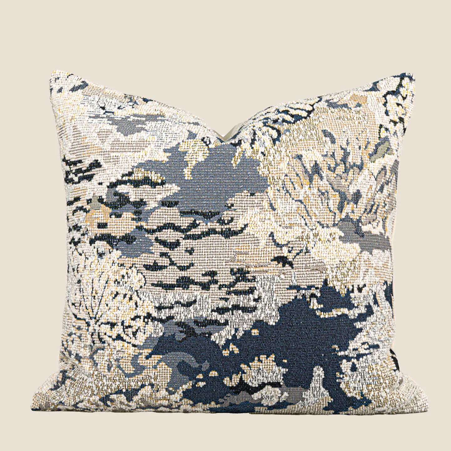 Antique blue abstract floral decorative pillow on a grey sofa, showing square and waist pillow sizes.