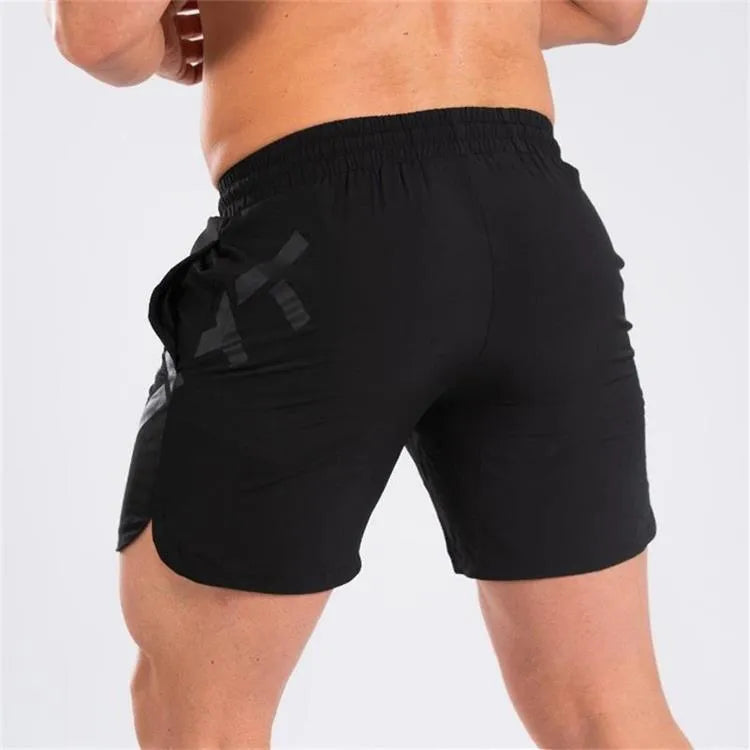 Men's elastic waist training running shorts in black with knee-length cut
