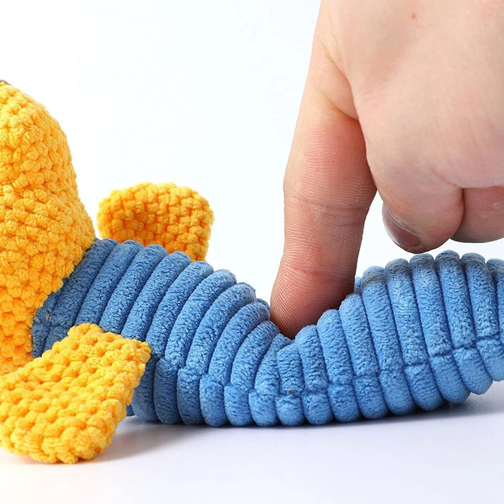 Soft plush dog squeaky toy in stuffed animal shape for dental cleaning chew.