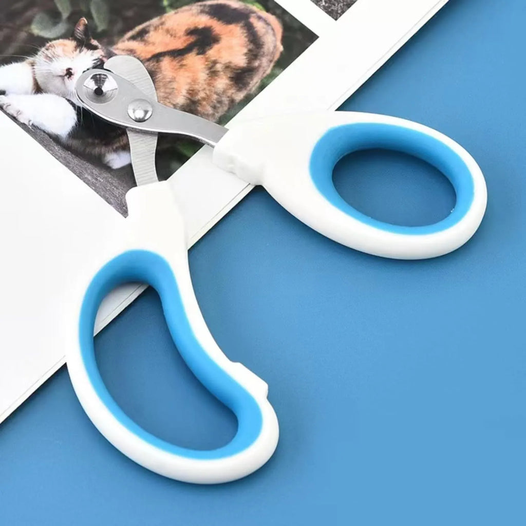 Blue pet nail clippers with a circular cutting hole and cushioned non-slip handle.