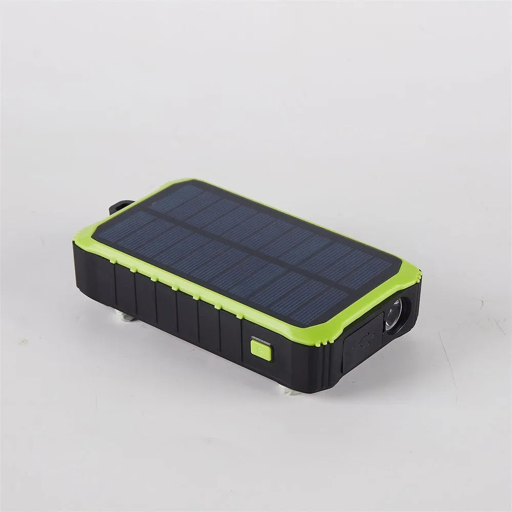 Green or orange hand crank solar power bank with LED light showing USB ports and solar panel.