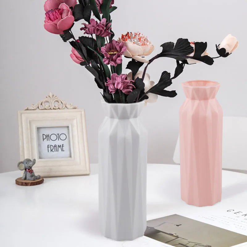 Green melamine plastic vase with 7.2cm base on a wooden table.