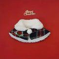 Red polyester pet scarf with white snowflake bell design wrapped around a dog's neck.