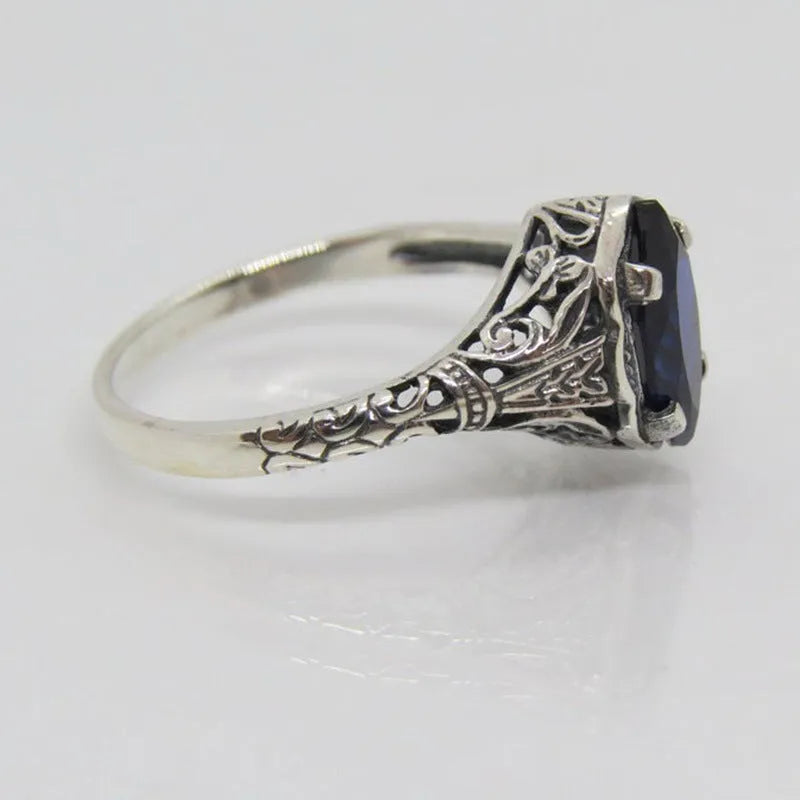 Silver geometric hollow women's ring shown in alloy with electroplated finish