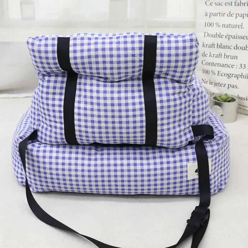 Car-mounted dog travel nest in stain-resistant cloth showing grey and blue plaid colour options