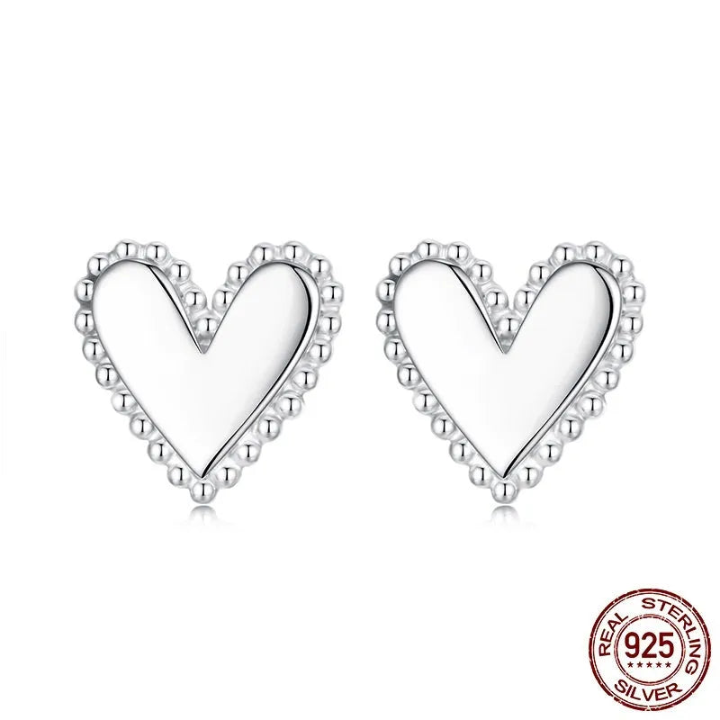 S925 sterling silver heart shaped stud earrings for women, electroplated finish, single pair on white background