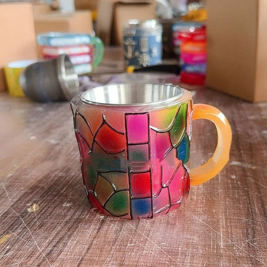 Painted synthetic resin decorative coffee cup ornament in library or patterned design