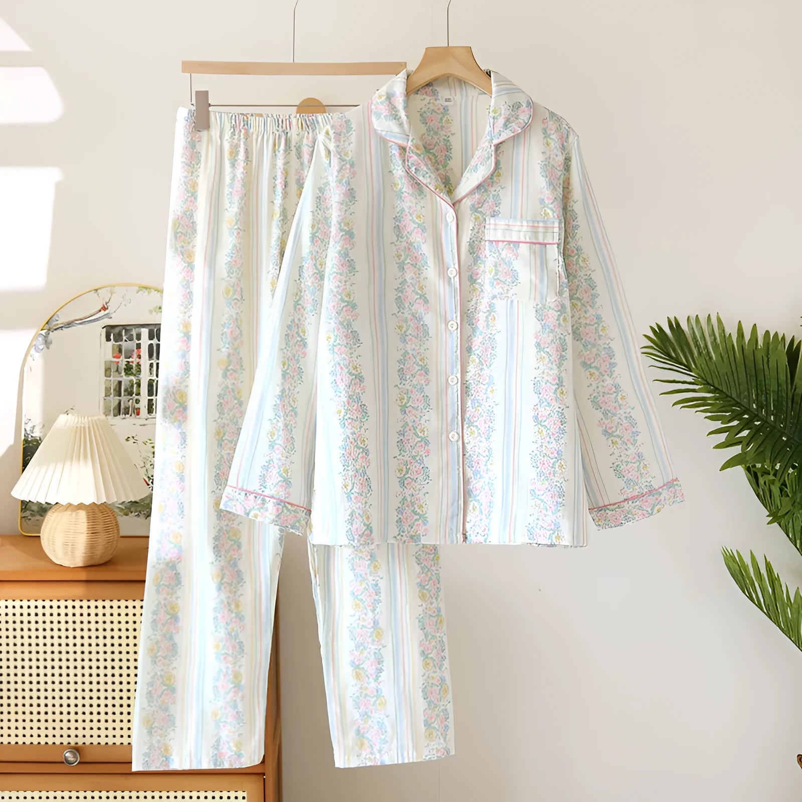 Women's cotton gauze long-sleeved pyjama set with trousers in a striped or small fruit print pattern.