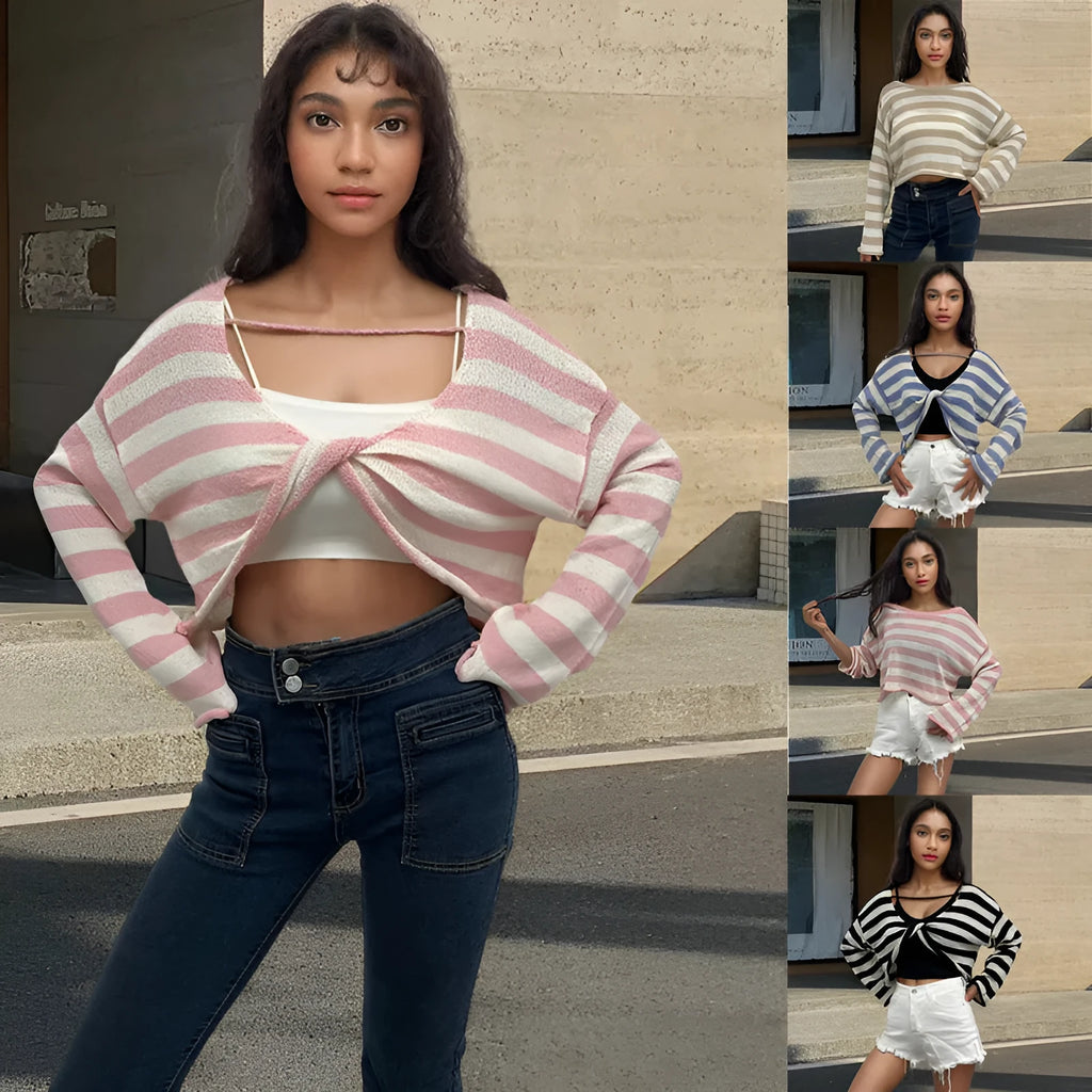 A woman wearing a black and white striped, cropped, long-sleeved sweater, showing the front and back reversible design.
