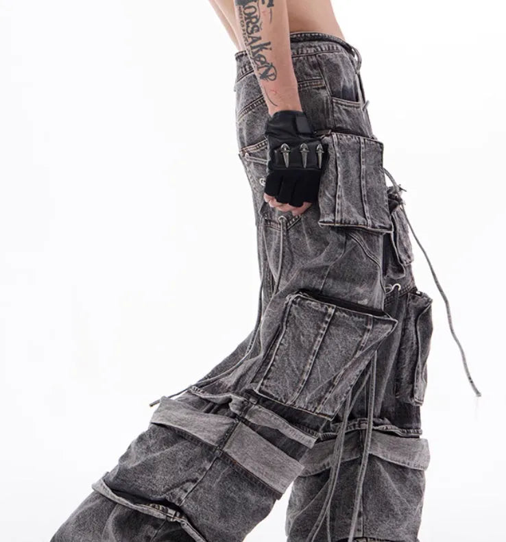 Grey distressed cotton denim mop pants with rope stitching, shown in a relaxed fit.
