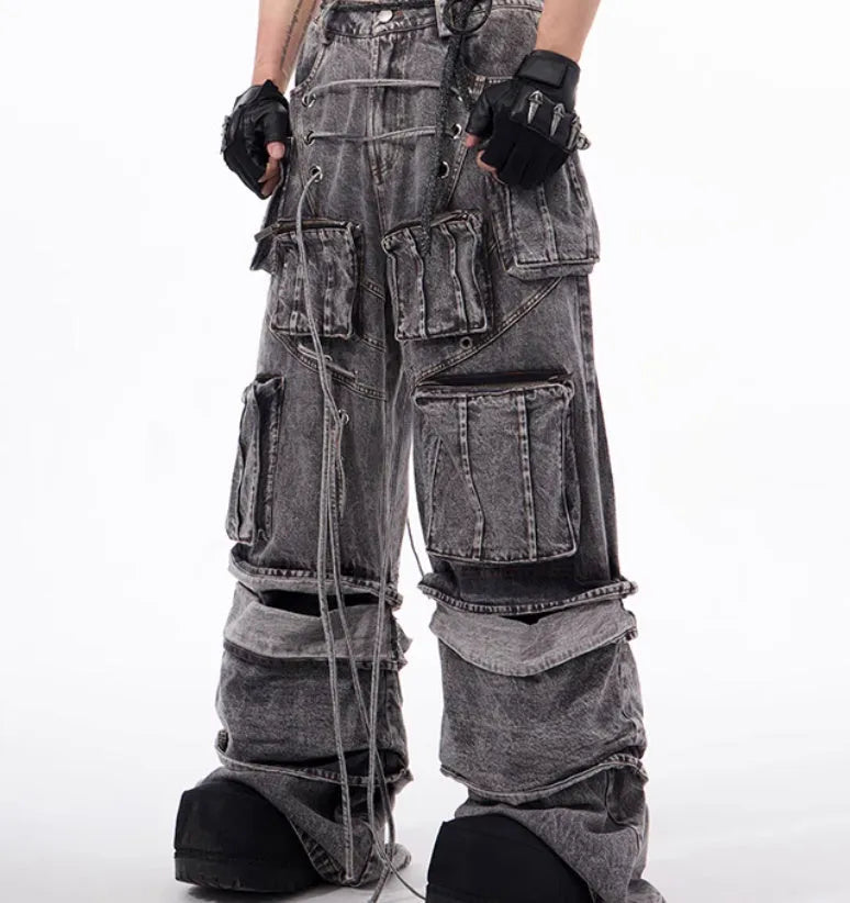 Grey distressed cotton denim mop pants with rope stitching, shown in a relaxed fit.