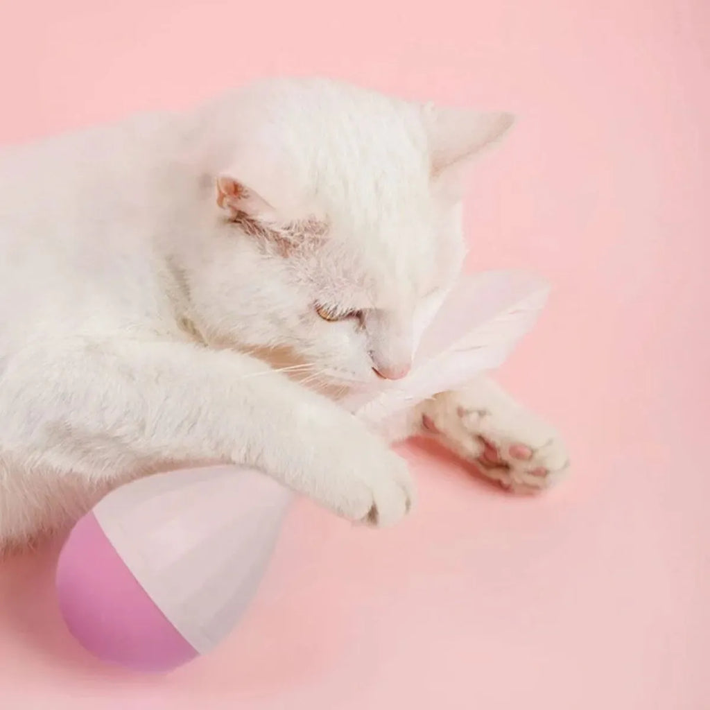Green feather tumbler cat toy with attached tease stick and aluminium alloy components