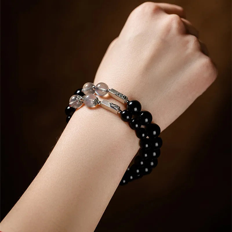 Obsidian Buddha beads couple bracelet set showing 8mm and 10mm bracelets in a national style.