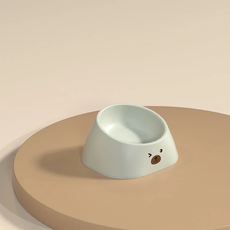 Green tilted stainless steel pet bowl showing 15-degree feeding angle