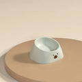 Green tilted stainless steel pet bowl showing 15-degree feeding angle