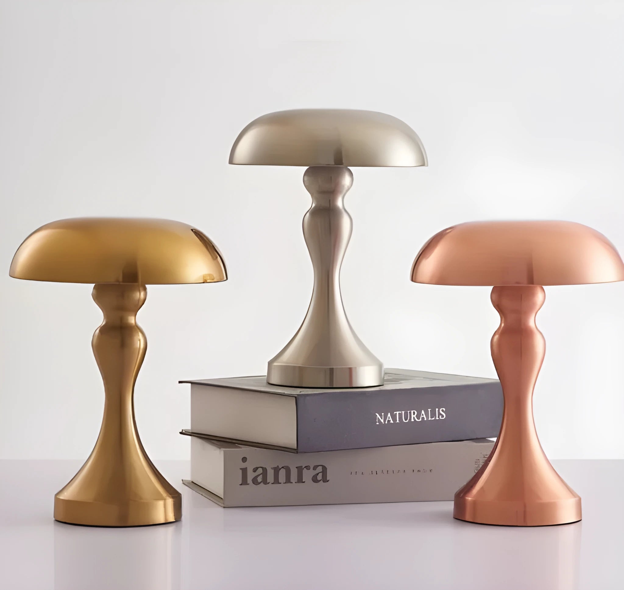Bronze finish USB rechargeable desk lamp with touch control for three light colours on a wooden desk.