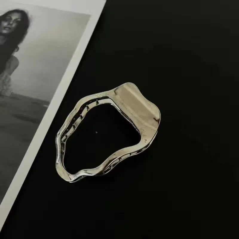 Gold and silver zinc alloy hair barrettes in arc, square, and triangle shapes for women.