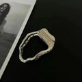 Gold and silver zinc alloy hair barrettes in arc, square, and triangle shapes for women.