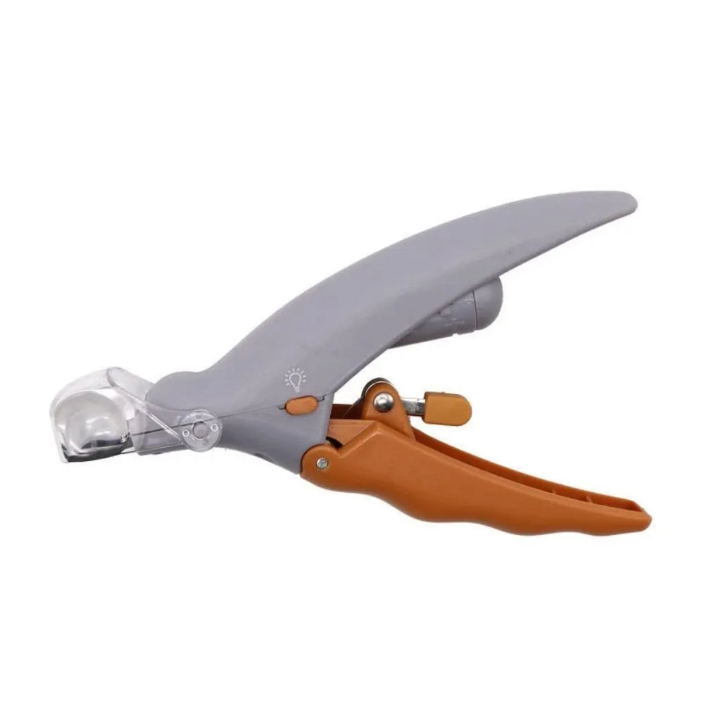 Yellow pet nail clipper with built-in LED light and magnifying glass for grooming dogs and cats.