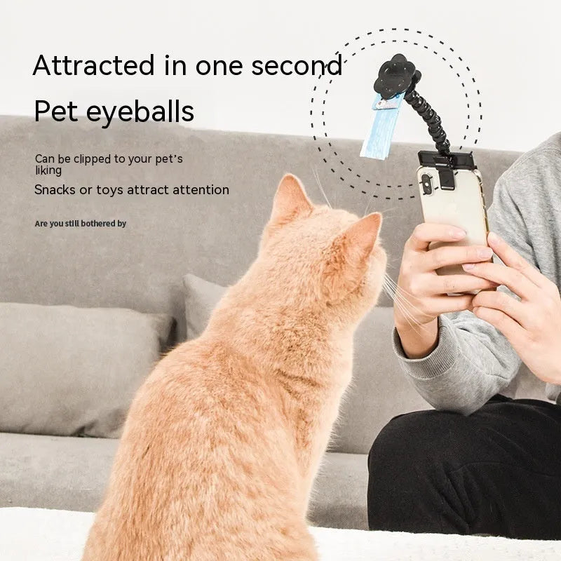 Black plastic pet photography clip tool holding mobile phone with snack grip attachment