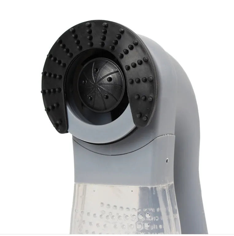 Grey portable electric pet hair vacuum cleaner with soft rubber brush head.