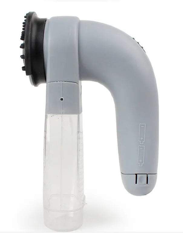 Grey portable electric pet hair vacuum cleaner with soft rubber brush head.