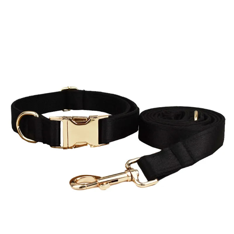 A complete cloth dog accessory set showing a collar, leash, chest strap, vest, and decorative bow in matching colours.