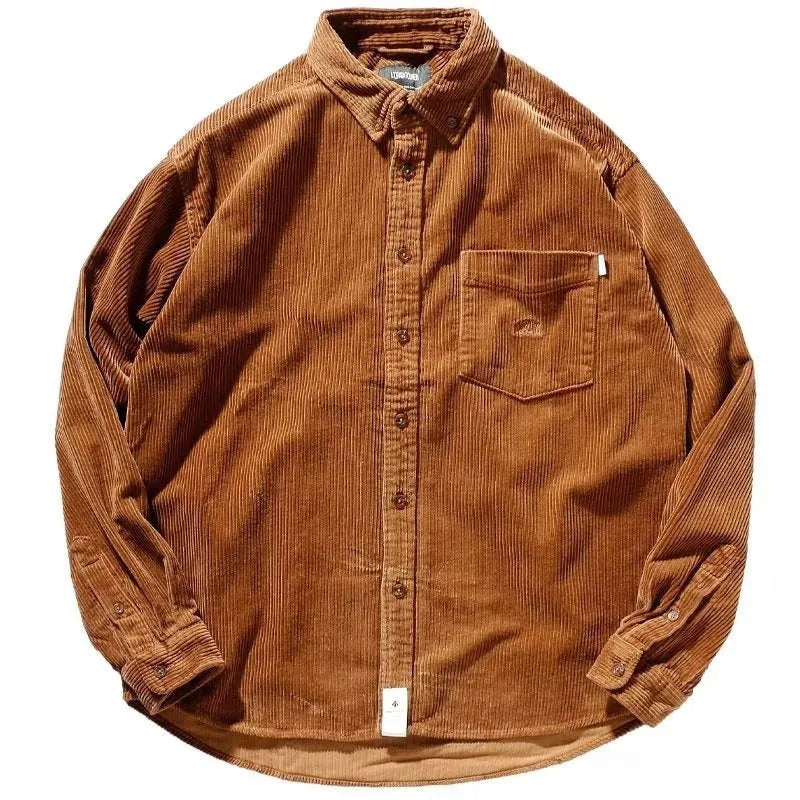 A caramel-coloured loose-fit corduroy long sleeve shirt laid flat, showing its cardigan-style cut and textured fabric.