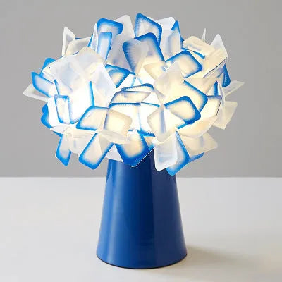 Nordic style metal table lamp in a choice of colours showing warm, white, and neutral light settings.
