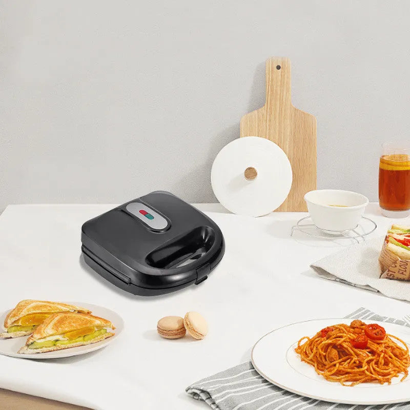 Black electric sandwich maker with six non-stick pans and a brushed stainless steel top cover.