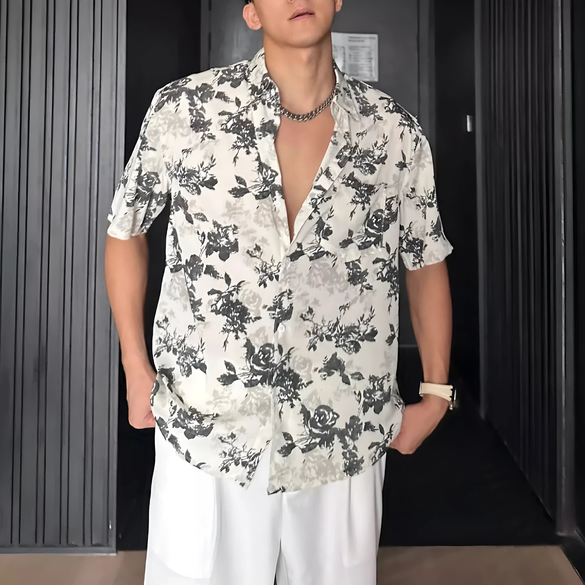 Men's black floral print short sleeve casual shirt with a loose fit and V-neck.