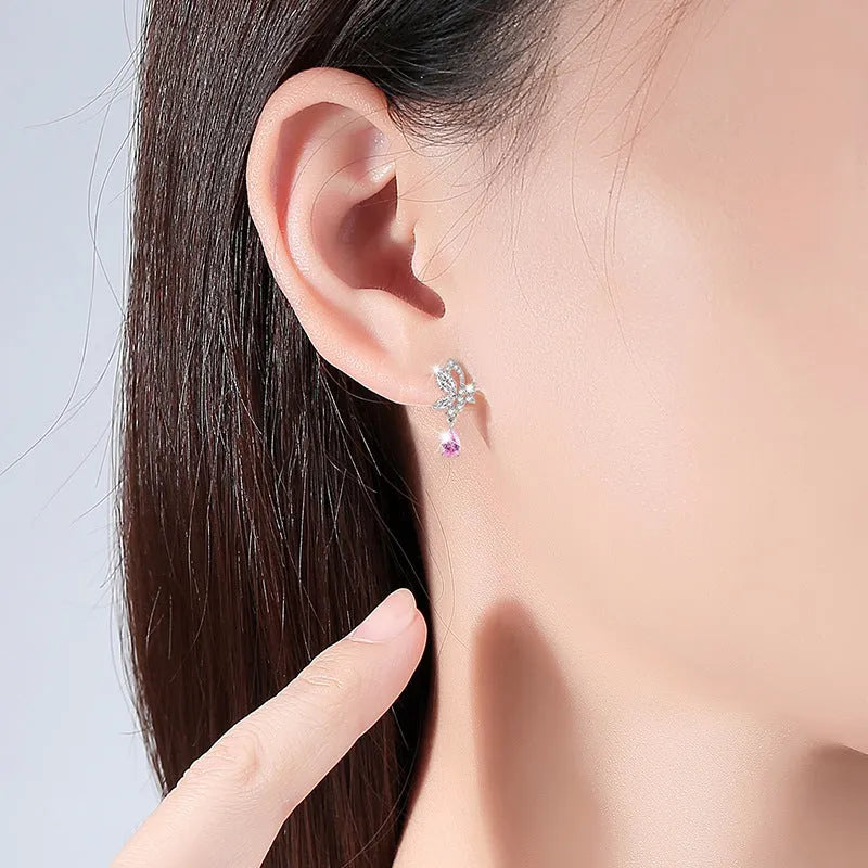 A pair of women's sterling silver stud earrings with a butterfly design and clear crystal accents.