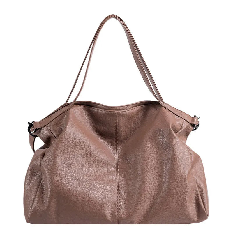 Soft surface large messenger tote bag in black with zipper opening and adjustable shoulder strap