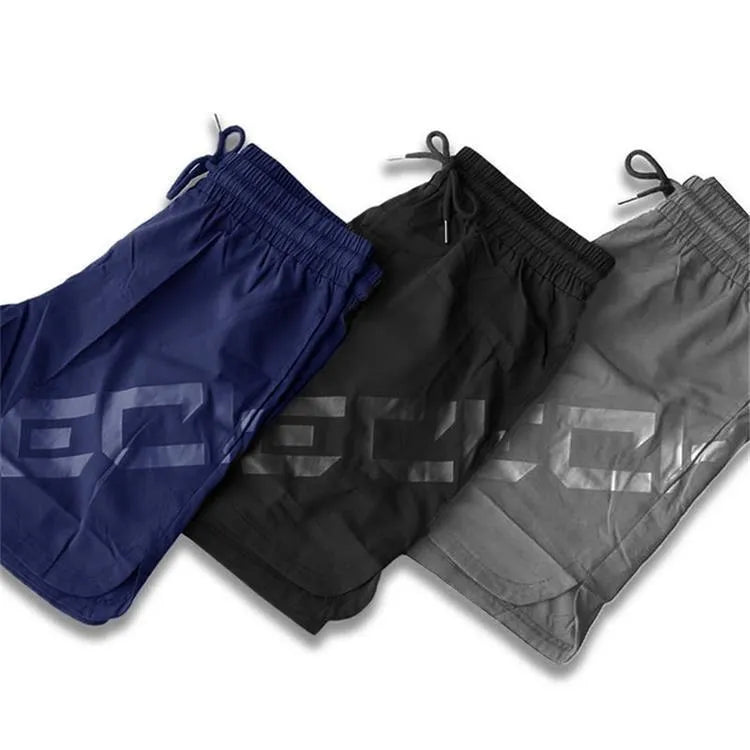 Men's elastic waist training running shorts in black with knee-length cut