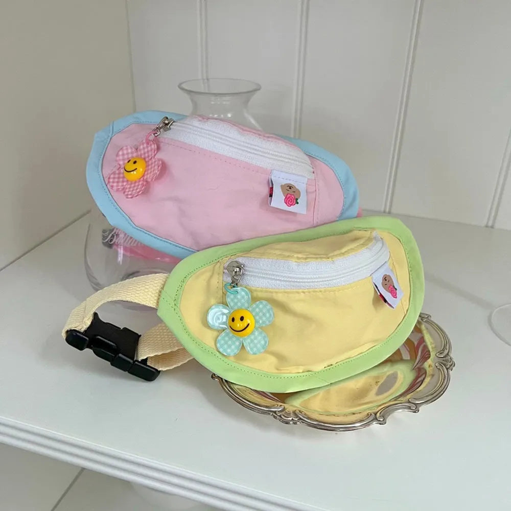 Powder blue soft fabric backpack carrier for a small dog or cat with adjustable chest straps.