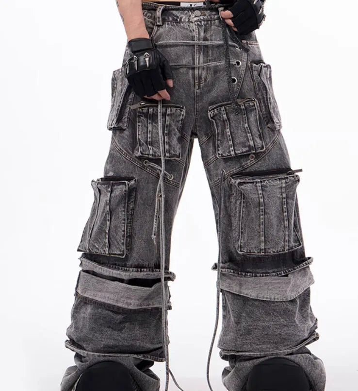Grey distressed cotton denim mop pants with rope stitching, shown in a relaxed fit.