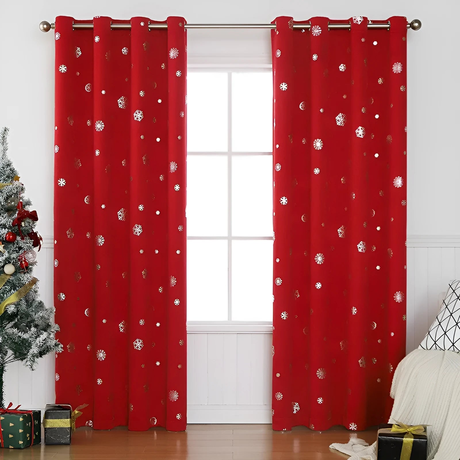 Red snowflake pattern shade cloth curtain with lace loop detailing hung on window