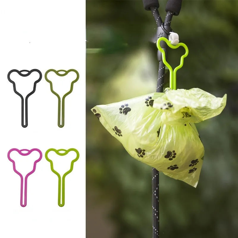 Dog poop bag holder with fixed Velcro clip attached to a leash for hands-free waste management during walks