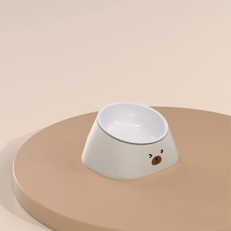 Green tilted stainless steel pet bowl showing 15-degree feeding angle